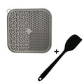 Grey textured silicone lick mat with suction cups and spreading spatula