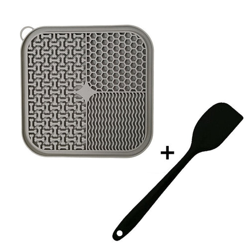Grey textured silicone lick mat with suction cups and spreading spatula