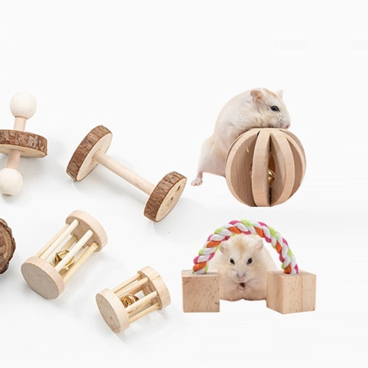 Close-up of the wooden chew toys and rope bridge